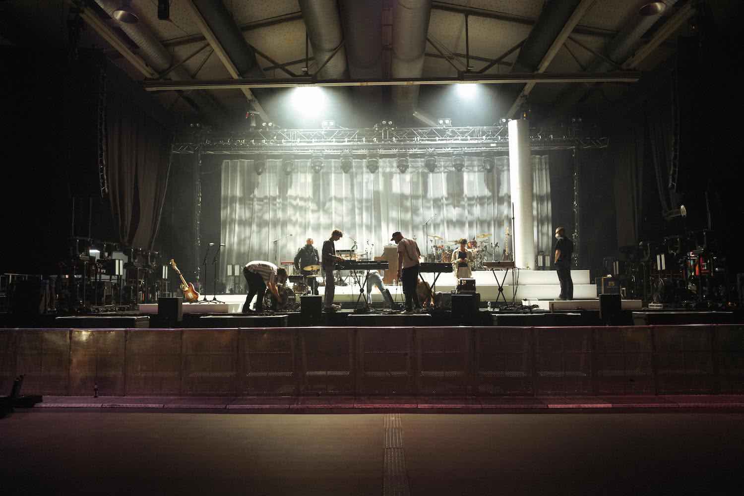 An empty stage rigged with lights before a show